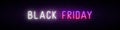 Long neon signboard with glowing Black friday inscription.