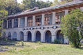 A long old building with windows and concrete columns Royalty Free Stock Photo