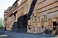 Long old rusty factory hall before reconstruction