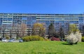 Long old style block of flats with green park in the foreground Royalty Free Stock Photo