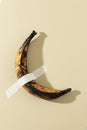 Long Over Riped Banana Duck Taped on Cream Wall