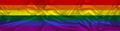 Long panorama of LGBT rainbow flag on delicate silk with folds, the concept of historical, tourism, emigration, economics,