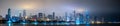 Long panoramic view of Chicago skyline at night with top of the buildings covered in fog Royalty Free Stock Photo