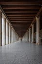 A long passage between many old columns Royalty Free Stock Photo