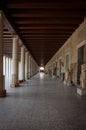 A long passage between many old columns Royalty Free Stock Photo
