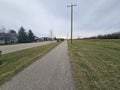 A long paved bike path between streets