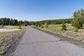 Long paved walking trail that leads from the Old Faithful area to the Morning Glory Pool in Yellowstone National Park