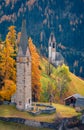 Long phocus autumn view of San Genesio and Santa Barbara churches. Royalty Free Stock Photo