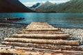 a long pier leading out onto the lake, sunrise on lake, long way out Royalty Free Stock Photo