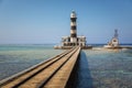 Long pier with lighthouse at the end Royalty Free Stock Photo