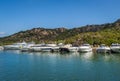 Long pier with recreational fleet boats. Poltu Quatu resort marina, Sardinia. Royalty Free Stock Photo