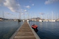 Long pier with red boat in the marina, Mindelo bay, Cape Verde Royalty Free Stock Photo