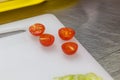 Long plum tomato halves isolated. Fresh small cherry tomatoes, mini organic cocktail tomate slice on white background top view Royalty Free Stock Photo