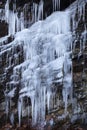 Long, pointed icicles draped on a cliff in Connecticut