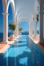 A long pool in a building with a view of the ocean. Digital image.