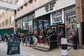 Long queue outside Rough Trade music shop in Brick Lane, East London, UK