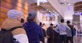 Long queue to checkout counter for clothing shopping. Cinematic video crowded shopping mall with buyers who are Royalty Free Stock Photo