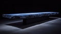 A long, rectangular table made of blue stone, illuminated from below, sits in a dimly lit room. Royalty Free Stock Photo