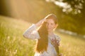 Long red hair woman in romantic sunset meadow Royalty Free Stock Photo