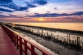 A long red wooden bridge, Wooden bridge of nature trail to see the sea Royalty Free Stock Photo