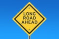 Long road ahead road sign