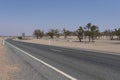 A long road alongside red dirt desert at outback rural of New South Wales, Australia.