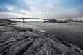 Long road bridge. Beautiful Norway landscape. Lofoten islands. Black-white photo with blue sky. Royalty Free Stock Photo