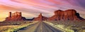 Long road at Monument Valley at sunset Royalty Free Stock Photo