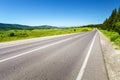 Long road with trees on roadside Royalty Free Stock Photo