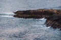 A long rocky cliff jutting out into the sea. Wonderful panoramic mountain landscape on the Barents sea