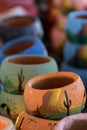 Long row of colorful ceramic pots in pottery workshop Royalty Free Stock Photo