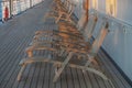 A long row of empty deck chairs Royalty Free Stock Photo