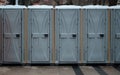 Long row of mobile toilets outside in the city. Bio toilets outdoors Royalty Free Stock Photo