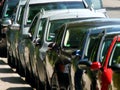 Long row of parking cars in teleperspective Royalty Free Stock Photo