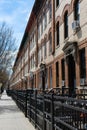 Row of Similar Apartment Buildings along an Empty Sidewalk in Astoria Queens New York