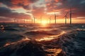 Long row of windturbines in sunset over the sea. Modern windmill park in the ocean. Green energy Royalty Free Stock Photo