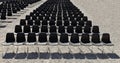 Long rows of empty black plastic chairs geometrically arranged under the sun. Copy space. Royalty Free Stock Photo