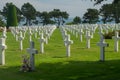Long rows of white crosses at the Normandy American Cemetery and Memorial, Normandy, France with the sea in the background Royalty Free Stock Photo