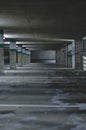 The long dark dirty empty parking garage Royalty Free Stock Photo