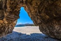 Stunning cave in the long sandy beach of triopetra