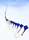 Long serial kites flying in the sky