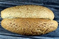 Long sesame bun bread, a fresh baked loaf of bread French Fino ready to fillings, typically filled with savory fillings, made from