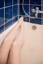 Long legs of young woman taking bath. Selfie shot in warm hipster-style color. Royalty Free Stock Photo
