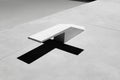 Long shadow cast by diving board on tranquil empty swimming pool surface Royalty Free Stock Photo