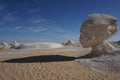 Long shadow of a head shaped rock formation in the white desert Royalty Free Stock Photo