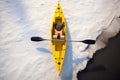 long shadow of kayak on white ice