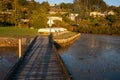 Long shadows on old wooden jetty Royalty Free Stock Photo