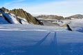 Long shadows of two persons on the Glacier du Tour