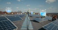 Engineer setting up solar panels