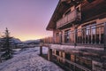 Long shot of the facade of a cabin in Alpe d Huez ski resort in the French Alps during sunrise Royalty Free Stock Photo